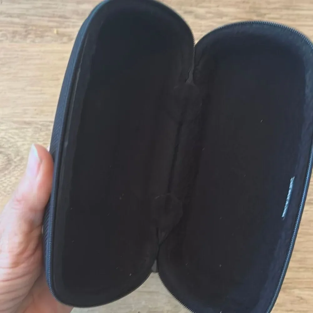 Revo hard sunglass zip around case. Black fleece lining